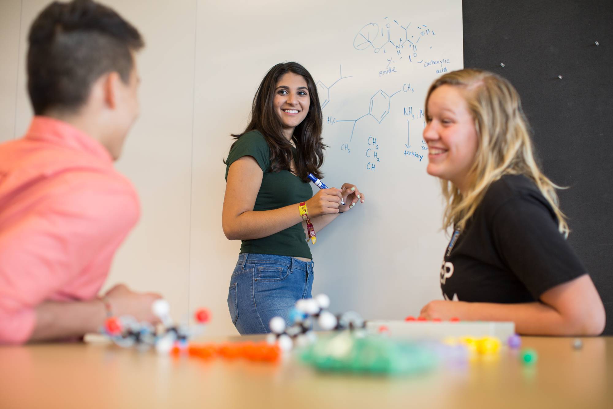Students smiling with peer mentor